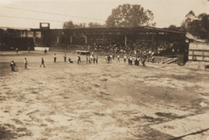 A photographic print of people being detained and moved into the McNulty baseball park, at 11th and Elgin.
