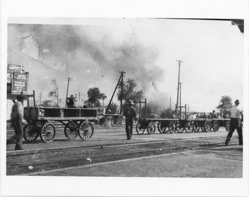 A photographic reproduction. This was taken at the intersection of Boston Avenue and the Frisco tracks, a center of the nighttime gun battle. "G16 of 28" written on back of this photograph.