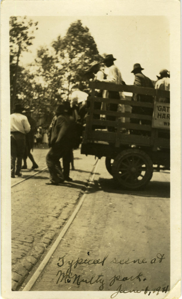 Black men being unloaded from a truck.